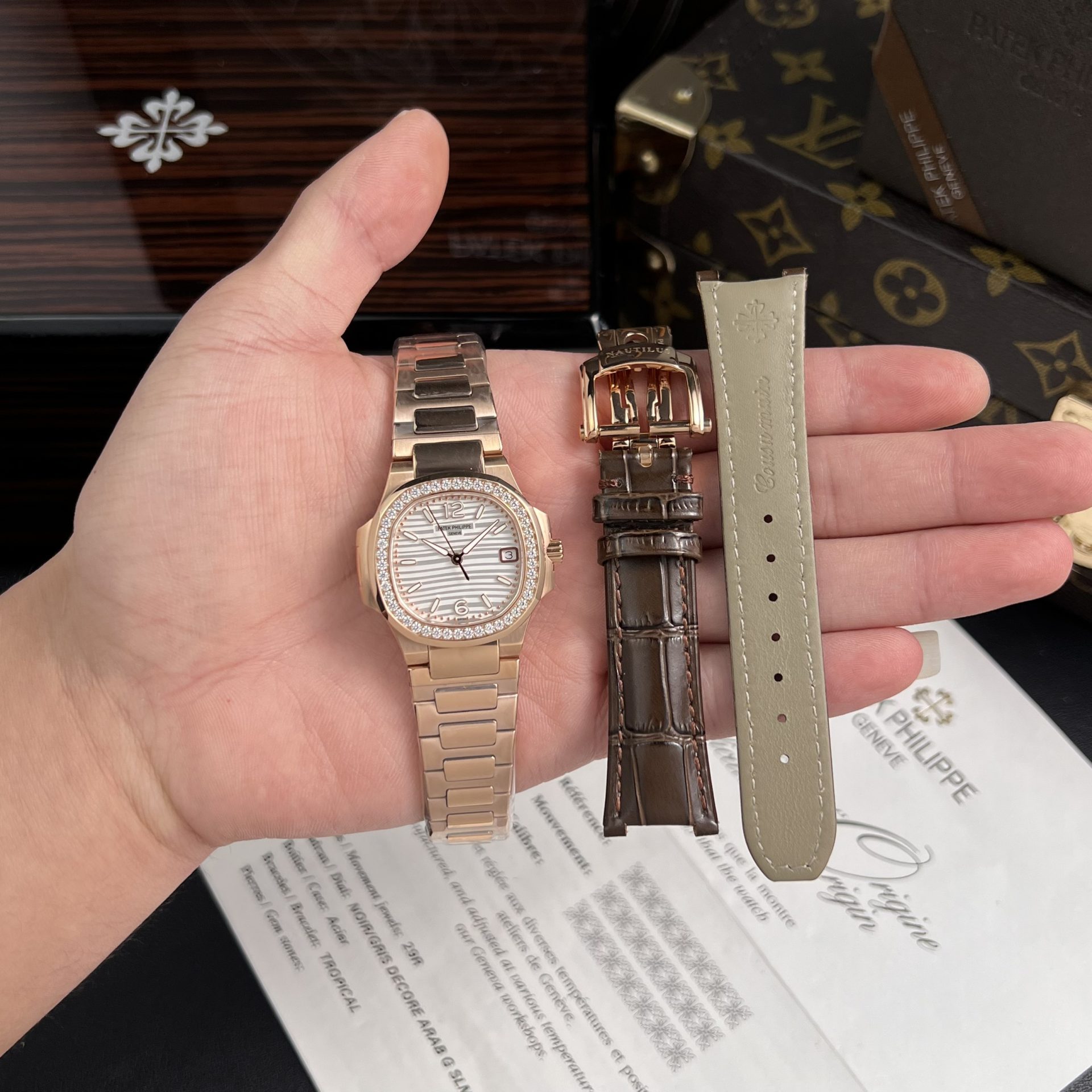 Dong-Ho-Patek-Philippe-Nautilus-7010-Replica-11-Nu-Mat-Trang-GR-Factory-32mm-1.jpg Patek Philippe Replica Watch Nautilus 7010 White Dial Womens GR Factory 32mm - Image 1