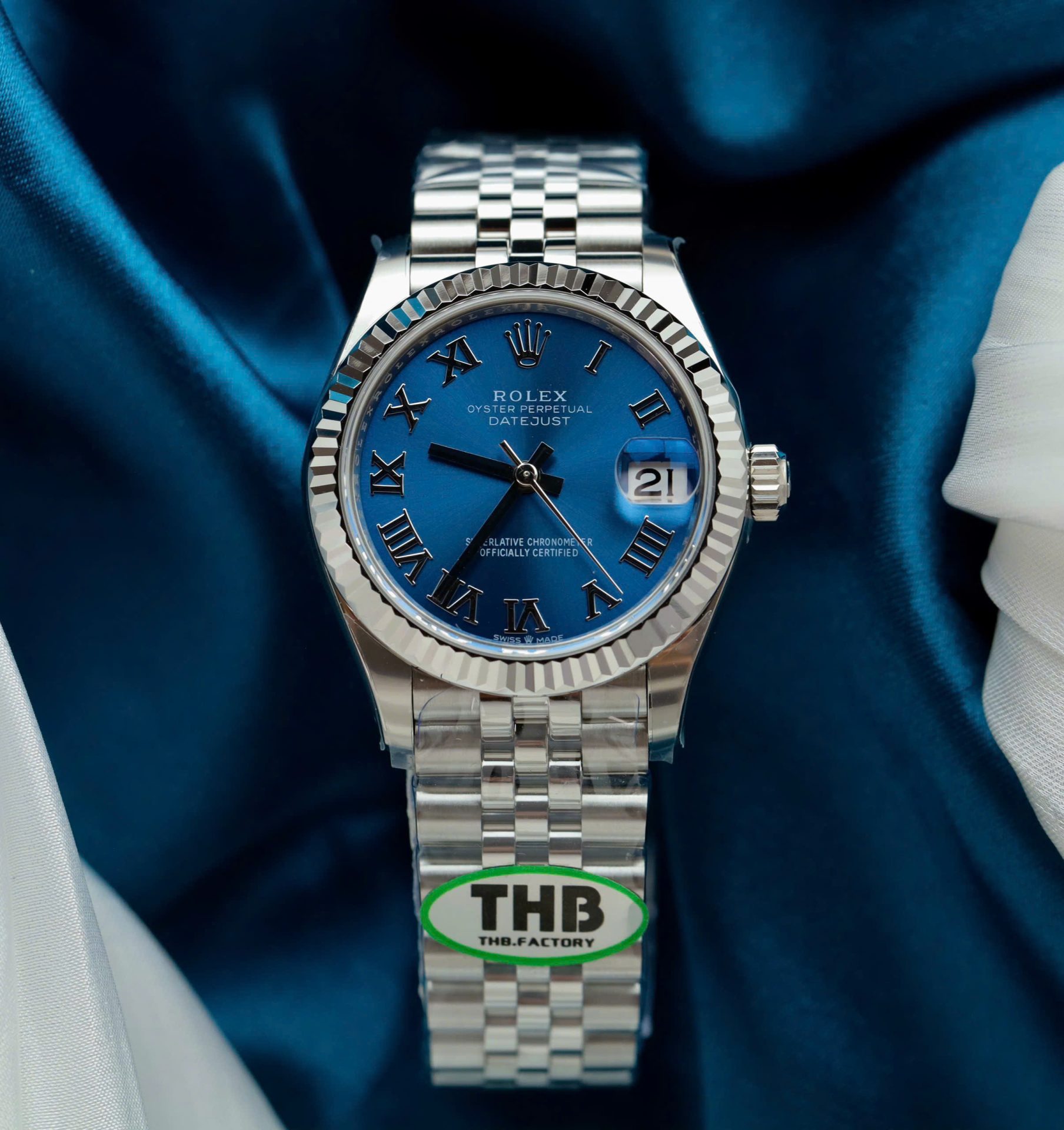 Dong-Ho-Rolex-DateJust-Replica-11-Mat-Xanh-Blue-Coc-So-La-Ma-Xuong-THB-31mm-10.jpg Rolex DateJust Replica Watches Women Blue Dial Jubilee Strap THB Factory 31mm - Image 1