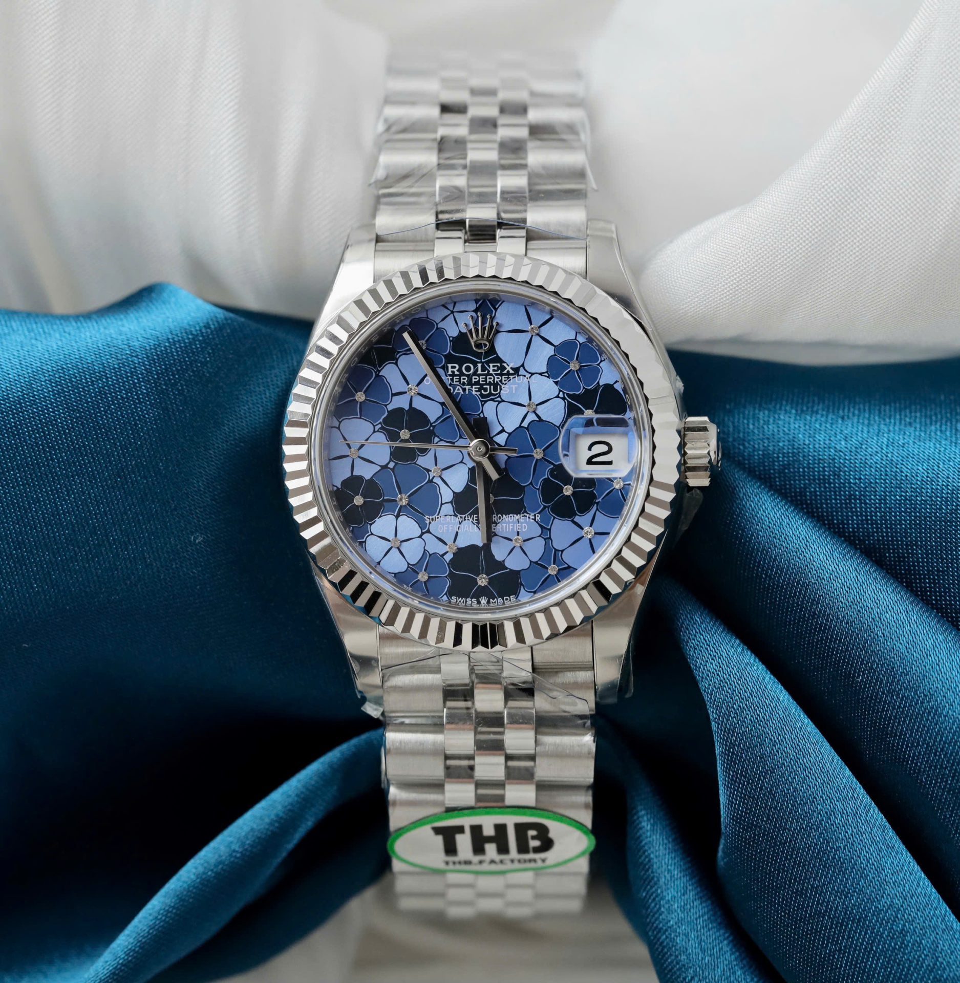 Dong-Ho-Rolex-DateJust-Replica-11-Nu-Mat-Hoa-Mau-Xanh-Blue-Xuong-THB-31mm-4.jpg Rolex DateJust Replica Watch Women Blue Flower Dial THB Factory 31mm - Image 1