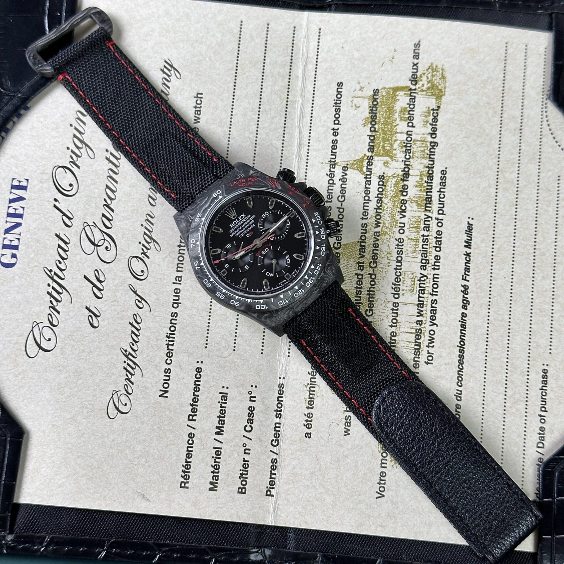 Dong-Ho-Rolex-Daytona-Diw-Carbon-Replica-11-Sieu-Nhe-40mm-9.jpg Rolex Daytona Diw Carbon Super Light Replica Watch 40mm - Image 1