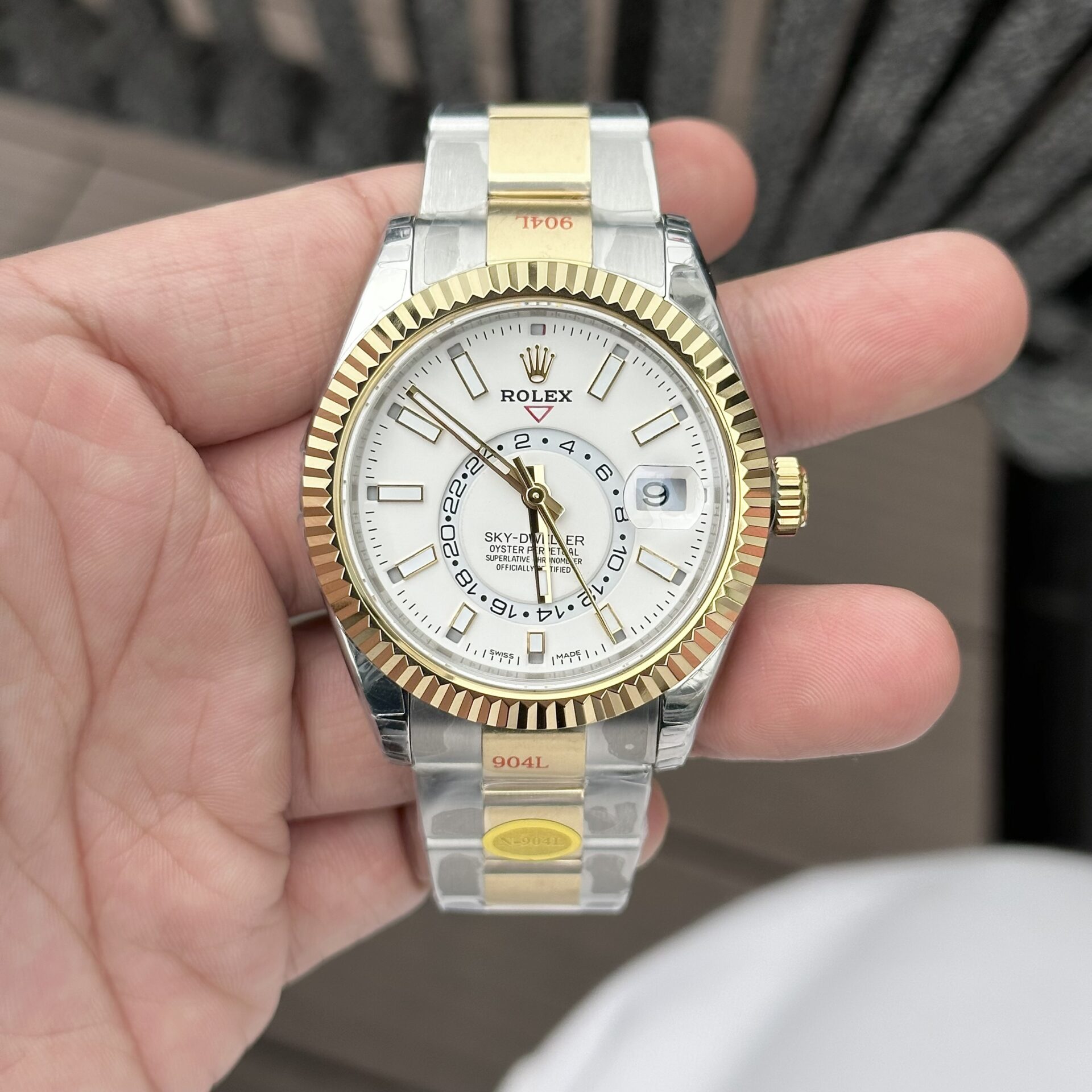 Dong-Ho-Rolex-Sky-Dweller-Replica-11-Nha-May-N-41mm-3.jpg Rolex Sky-Dweller Replica Watch White Dial Demi Oyster Strap Factory N 41mm - Image 1