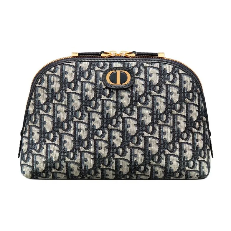 89cdf5b6bbd044cd826e56d470e486d7.webp 30 Montaigne Medium Clutch in Embroidered Oblique Canvas - Image 1