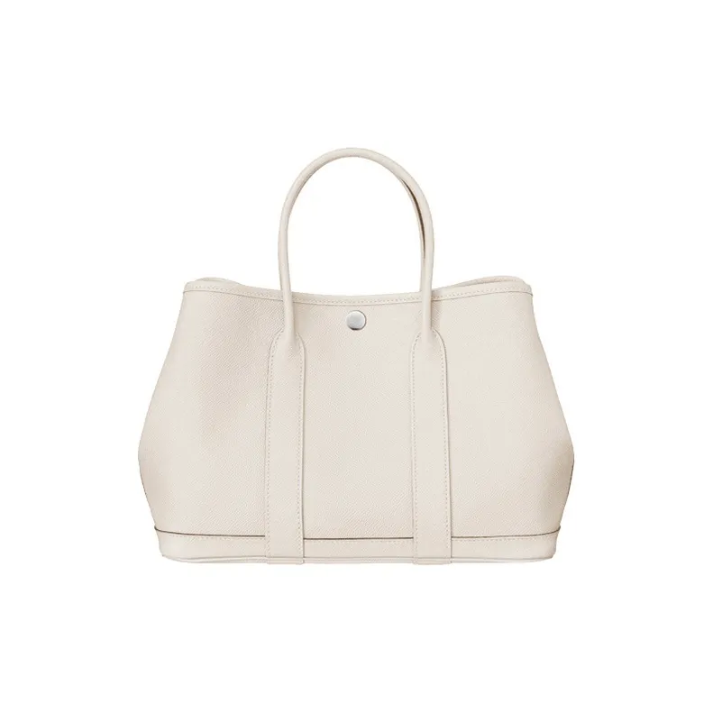 9ab1ed038f1f495fb21153dec8925cd5.webp Hermès Garden Party 36 Tote – Craie (Chalk White) - Image 1